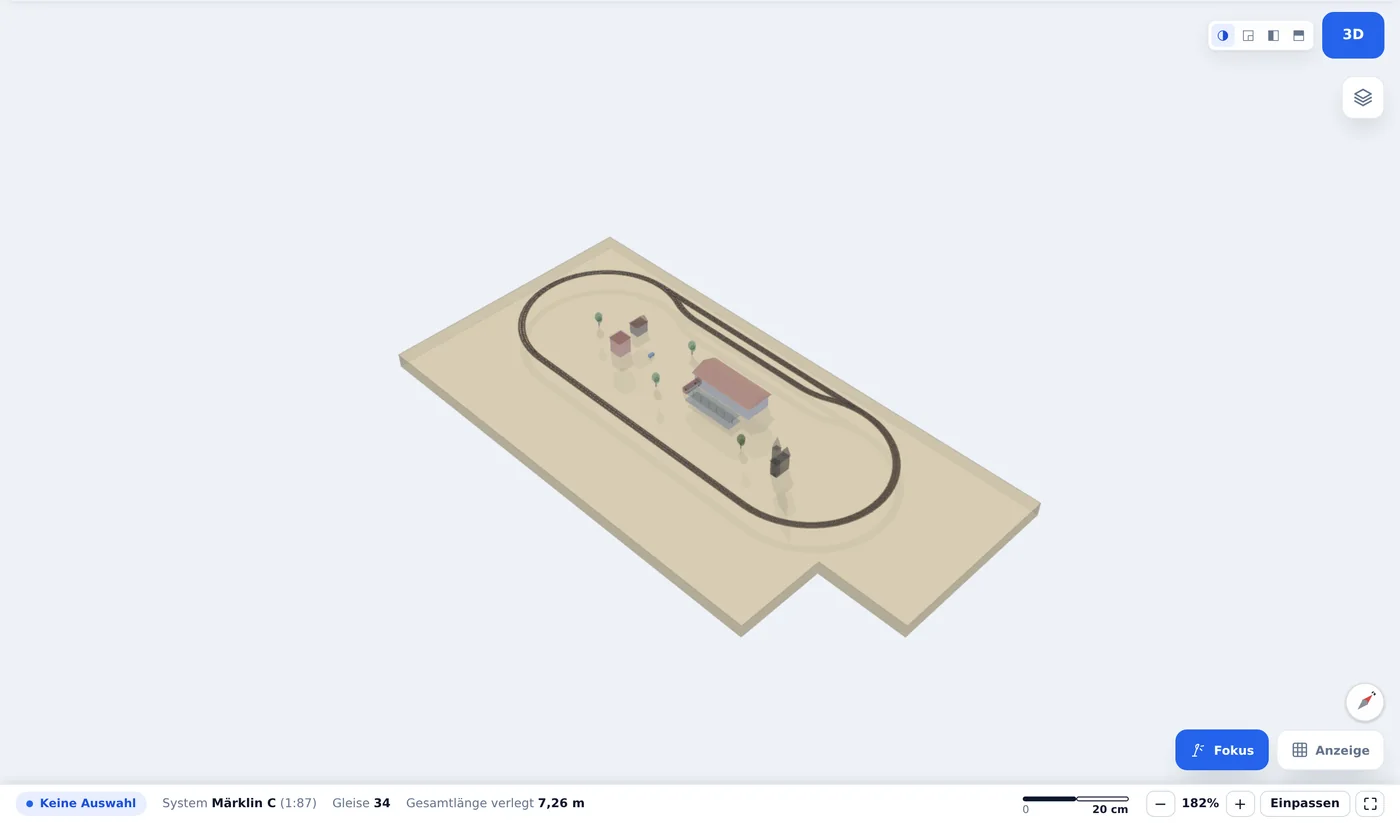 Dieselbe Anlage in der 3D-Ansicht, mit Bahnhof, Bahnsteig, Häusern und Bäumen auf der Grundplatte.