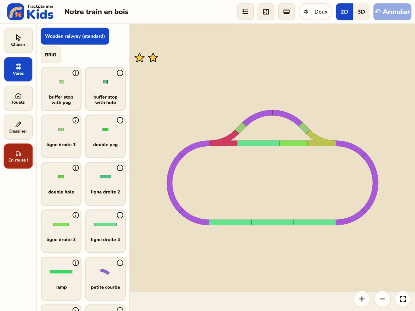 Trackplanner Kids pendant la construction : à gauche, de grandes vignettes avec des rails en bois ; à droite, un ovale avec une gare